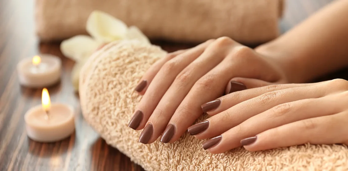 perfectly manicured brown coloured nails