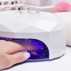 LED nail lamp in use during gel nail treatment at the Skincare Centre, Sittingbourne