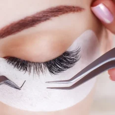 woman having eyelash extensions